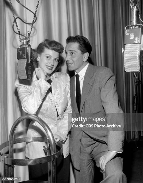 Lux Radio Theater presentation of 'Slatterys Hurricane.' Left to right, Maureen OHara and Richard Conte . March 6, 1950. Hollywood, CA.