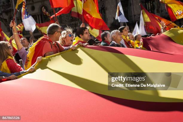 Protesters take part in a pro-unity demonstration on October 29, 2017 in Barcelona, Spain. Thousands of pro-unity protesters have gathered in...