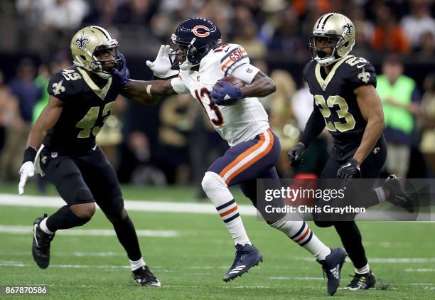 Kendall Wright of the Chicago Bears is tackled by Marcus Williams of the New Orleans Saints during the second quarter at the Mercedes-Benz Superdome...