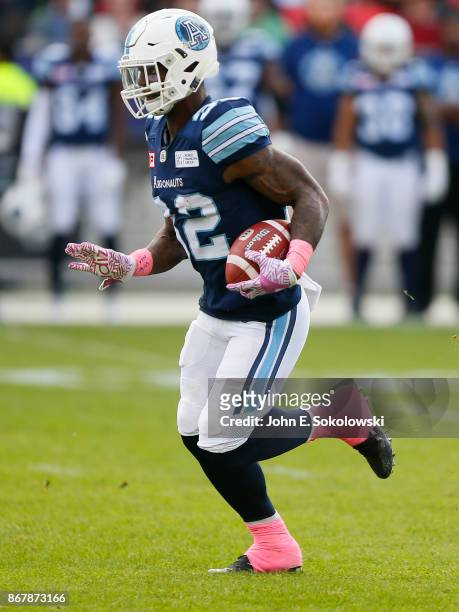 James Wilder Jr. #32 of the Toronto Argonauts carries the ball against the Saskatchewan Roughriders during a game at BMO field on October 7, 2017 in...