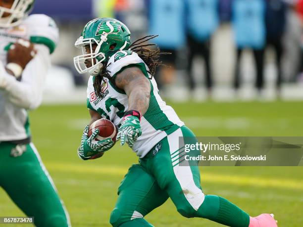 Trent Richardson of the Saskatchewan Roughriders carries the ball against the Toronto Argonauts during a game at BMO field on October 7, 2017 in...