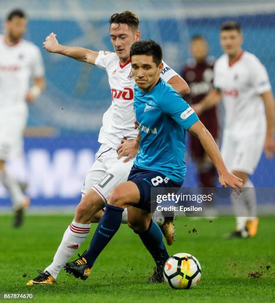 Matias Kranevitter of FC Zenit Saint Petersburg and Anton Miranchuk of FC Lokomotiv Moscow vie for the ball during the Russian Football League match...