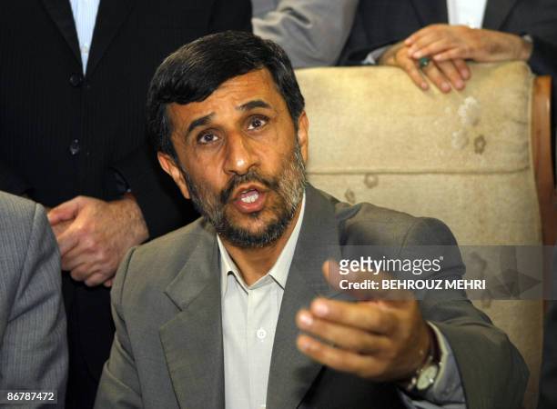 Iranian President Mahmoud Ahmadinejad speaks to journalists as he registers his candidacy for the upcoming presidential elections at the interior...