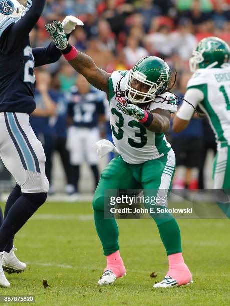 Trent Richardson of the Saskatchewan Roughriders blocks against the Toronto Argonauts during a game at BMO field on October 7, 2017 in Toronto,...
