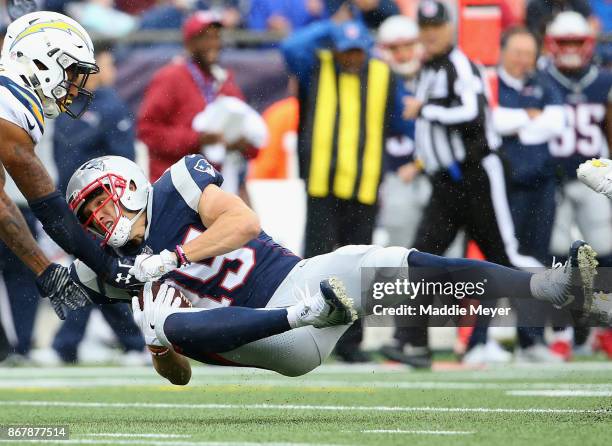 Chris Hogan of the New England Patriots catches a pass during the third quarter of a game against the Los Angeles Chargers at Gillette Stadium on...