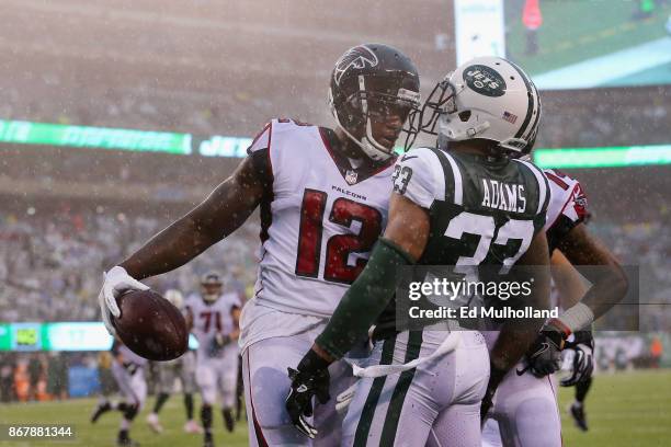 Wide receiver Mohamed Sanu of the Atlanta Falcons celebrates his celebrates his touchdown against strong safety Jamal Adams of the New York Jets...