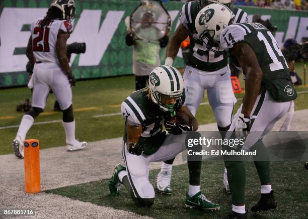 Wide receiver Robby Anderson of the New York Jets celebrates scoring a touchdown with teammate wide receiver wide receiver Jeremy Kerley against the...