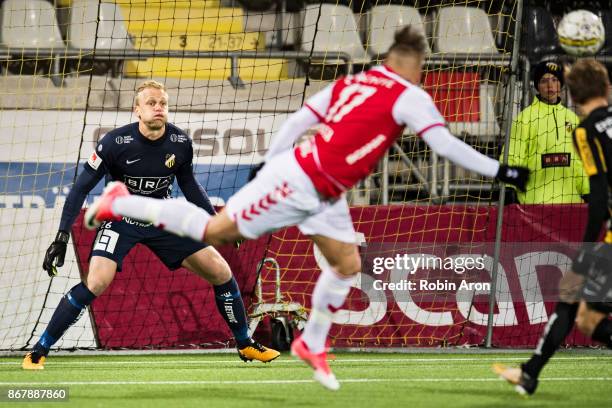 Peter Abrahamsson, goalkeeper of BK Hacken concentrated on the ball, Romario Marques Rodrigues of Kalmar FF doing a header towards the goal during...