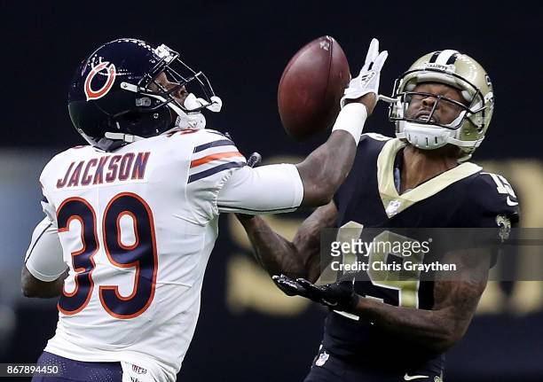 Ted Ginn of the New Orleans Saints catches a pass as he is defended by Eddie Jackson of the Chicago Bears during the fourth quarter at the...