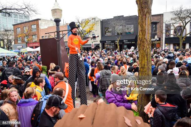 Attendees gather for the unveiling of the first, exclusive samples of new Reese's Outrageous Bars at Royal Oak, MichiganÕs annual Halloween...