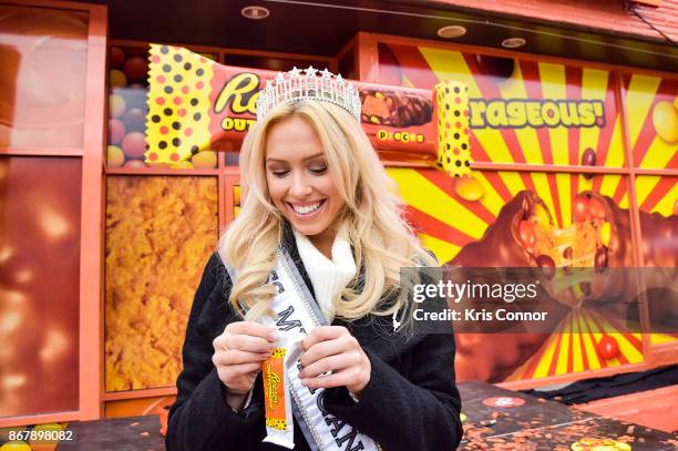 Elizabeth Johnson, 2018 Miss Michigan USA, enjoys one of the first, exclusive samples of new Reese's Outrageous Bars at Royal Oak, MichiganÕs annual...