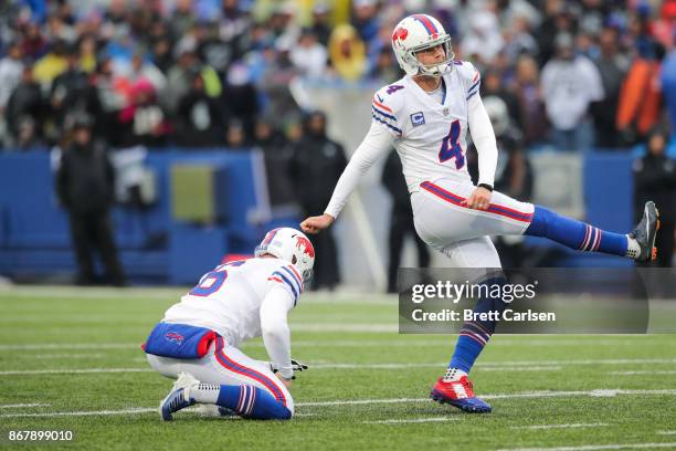 Stephen Hauschka of the Buffalo Bills watches the ball after kicking a point after touchdown during the third quarter of an NFL game against the...