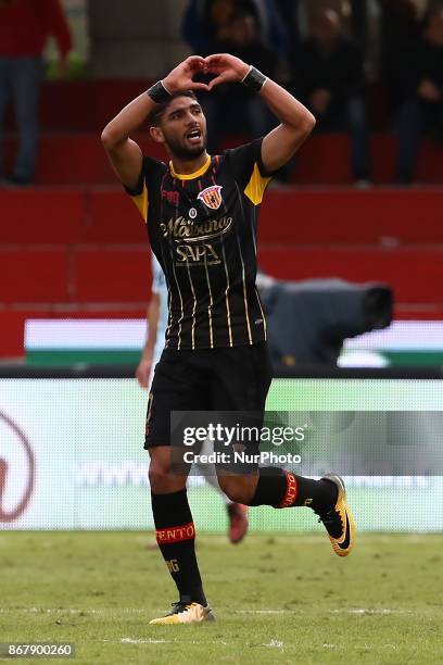 Benevento's Moroccan defender Achraf Lazaar celebrates after scoring next to Lazio's forward from Italy Ciro Immobile during the Italian Serie a...