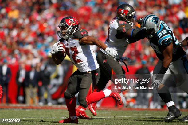 Running back Doug Martin of the Tampa Bay Buccaneers makes 14-yard gain during the third quarter of an NFL football game against the Carolina...