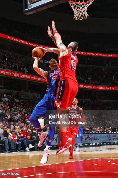 Jon Leuer of the Detroit Pistons goes to the basket against the Washington Wizards on October 20, 2017 at Capital One Arena in Washington, DC. NOTE...