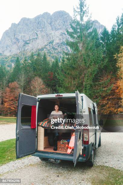 Woman in the camper van in Austrian  mountains