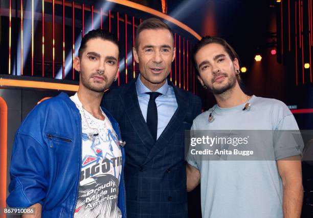 Bill Kauitz, Kai Pflaume and Tom Kaulitz attend the 'Klein gegen Gross - Das unglaubliche Duell' TV Show photocall at Studio Adlershof on October 29,...