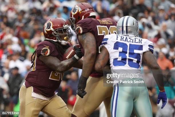 Running back Rob Kelley celebrates with offensive tackle Morgan Moses of the Washington Redskins after scoring a touchdown against the Dallas Cowboys...