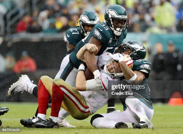 Beathard of the San Francisco 49ers is sacked by Mychal Kendricks, Brandon Graham and Malcolm Jenkins of the Philadelphia Eagles in the second half...