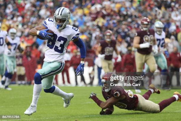 Wide receiver Terrance Williams of the Dallas Cowboys runs upfield past cornerback Kendall Fuller of the Washington Redskins during the first quarter...