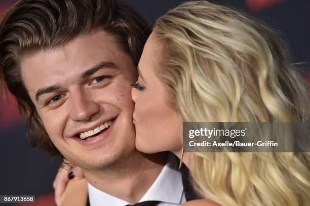 Actors Joe Keery and Maika Monroe arrive at the premiere of Netflix's 'Stranger Things' Season 2 at Regency Bruin Theatre on October 26, 2017 in Los...