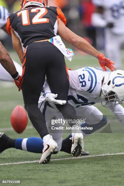 Chris Milton of the Indianapolis Colts forces a fumble on Alex Erickson of the Cincinnati Bengals during their game at Paul Brown Stadium on October...