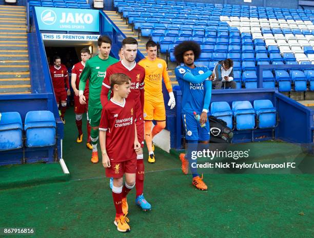 Captains Corey Whelan of Liverpool and Hamza Choudhury of Leicester City make their way from the tunnel before the Liverpool v Leicester City PL2...