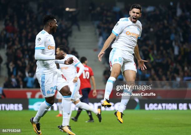 Morgan Sanson of OM celebrates his goal with Andre Zambo Anguissa during the French Ligue 1 match between Lille OSC and Olympique de Marseille at...
