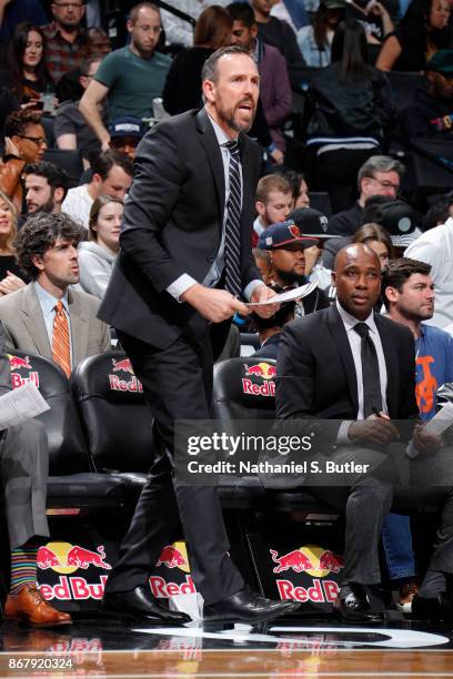 Assistant Coach Chris Fleming of the Brooklyn Nets coaches during the game against the Orlando Magic on October 20, 2017 at Barclays Center in...