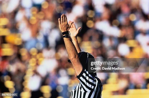 american football, referee giving touchdown signal, crowd behind - touchdown signal stock pictures, royalty-free photos & images