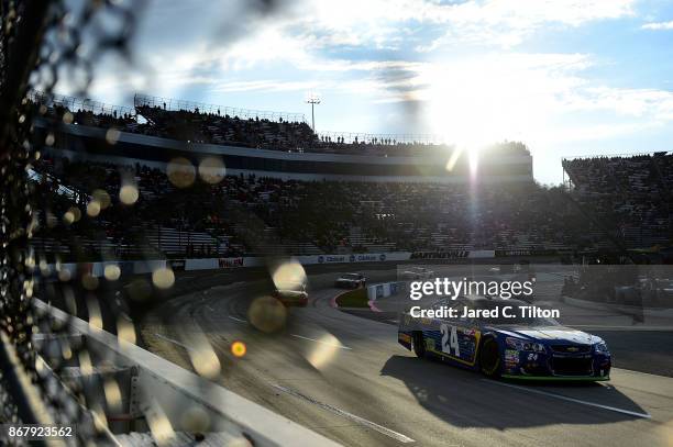 Chase Elliott, driver of the NAPA Chevrolet, leads a pack of cars during the Monster Energy NASCAR Cup Series First Data 500 at Martinsville Speedway...