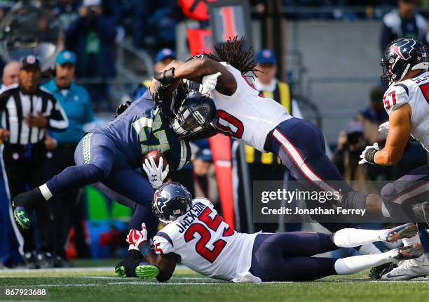 Running back Eddie Lacy of the Seattle Seahawks is tackled as he rushes during the second quarter of the game against the Houston Texans at...