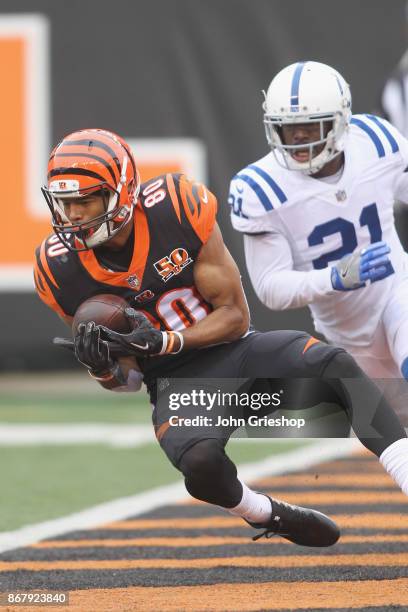 Josh Malone of the Cincinnati Bengals hauls in the touchdown pass against Vontae Davis of the Indianapolis Colts during their game at Paul Brown...
