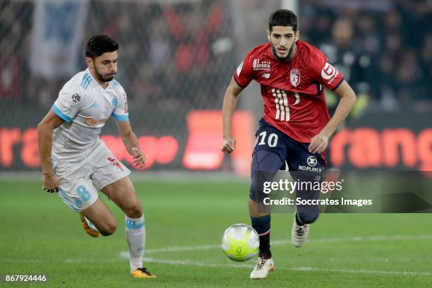 Morgan Sanson of Olympique Marseille, Yassine Benzia of Lille during the French League 1 match between Lille v Olympique Marseille at the Stade...