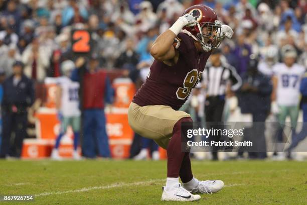 Outside linebacker Ryan Kerrigan of the Washington Redskins celebrates after sacking quarterback Dak Prescott of the Dallas Cowboys during the second...