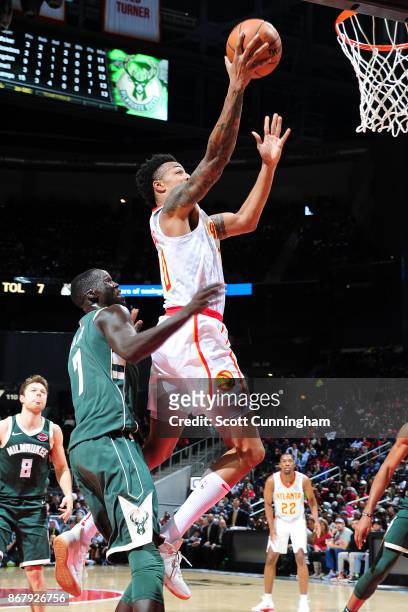 John Collins of the Atlanta Hawks drives to the basket against the Milwaukee Bucks on October 29, 2017 at Philips Arena in Atlanta, Georgia. NOTE TO...