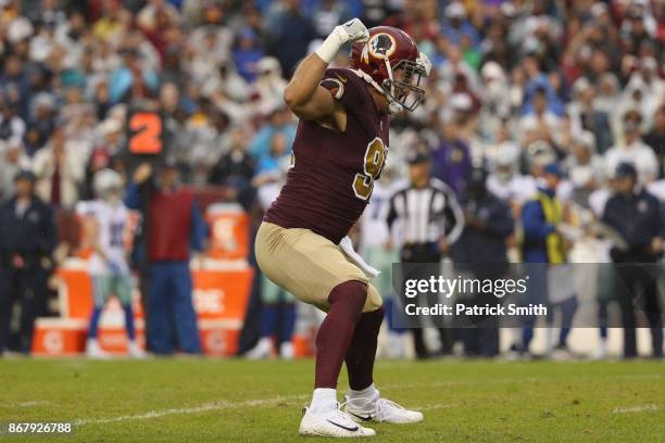 Outside linebacker Ryan Kerrigan of the Washington Redskins celebrates after sacking quarterback Dak Prescott of the Dallas Cowboys during the second...