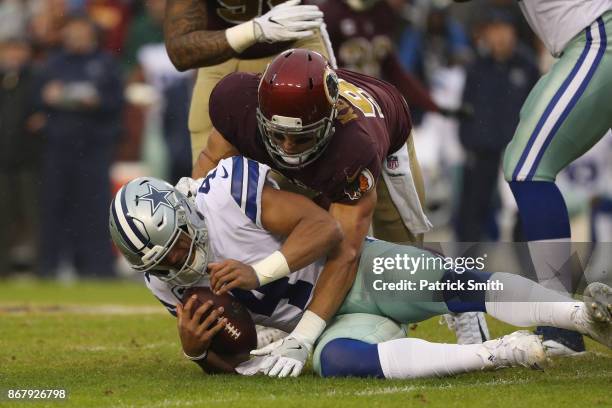 Outside linebacker Ryan Kerrigan of the Washington Redskins sacks quarterback Dak Prescott of the Dallas Cowboys during the second quarter at FedEx...