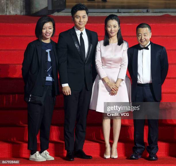 Actor Li Chen, actress Zhao Tao and director Jia Zhangke arrive at the red carpet of the 1st Pingyao Crouching Tiger Hidden Dragon International Film...