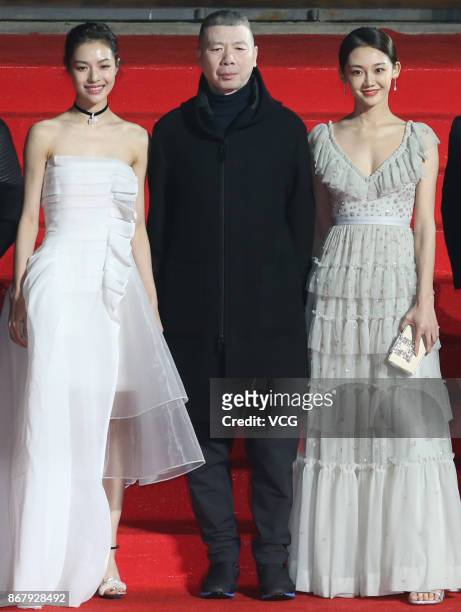 Actress Elaine Zhong Chuxi, director Feng Xiaogang and actress Miao Miao arrive at the red carpet of the 1st Pingyao Crouching Tiger Hidden Dragon...
