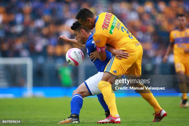 Felipe Mora of Cruz Azul struggles for the ball with Juninho of Tigres during the 15th round match between Cruz Azul and Tigres UANL as part of the...