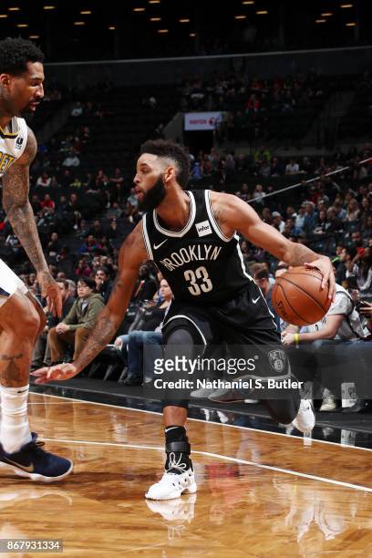 Allen Crabbe of the Brooklyn Nets handles the ball against the Denver Nuggets on October 29, 2017 at Barclays Center in Brooklyn, New York. NOTE TO...