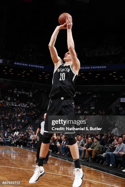 Timofey Mozgov of the Brooklyn Nets shoots the ball against the Denver Nuggets on October 29, 2017 at Barclays Center in Brooklyn, New York. NOTE TO...