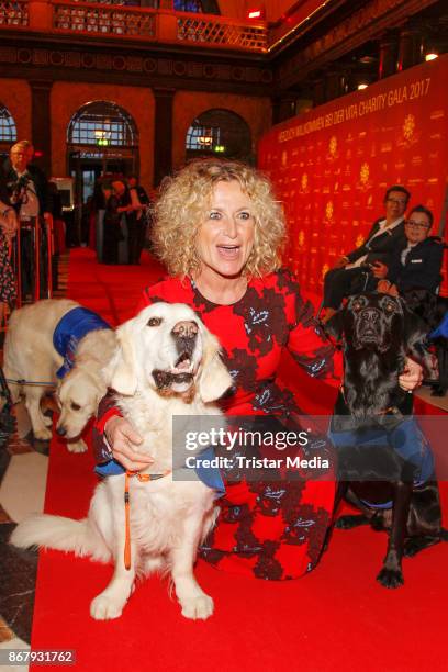 Author Susanne Froehlich with assistance dogs during the 8th VITA Charity Gala In Wiesbaden on October 28, 2017 in Wiesbaden, Germany.