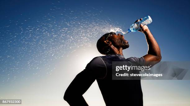 drinking water - water bottle splash stock pictures, royalty-free photos & images