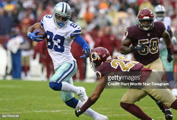 Dallas Cowboys wide receiver Terrance Williams eludes Washington Redskins cornerback Kendall Fuller to pickup a first down in the first quarter on...