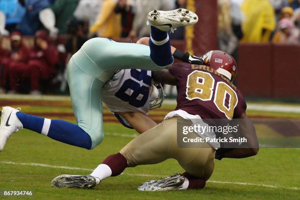 Wide receiver Jamison Crowder of the Washington Redskins makes a catch against strong safety Jeff Heath of the Dallas Cowboys during the first...