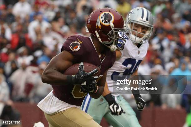 Wide receiver Jamison Crowder of the Washington Redskins makes a catch against strong safety Jeff Heath of the Dallas Cowboys during the first...
