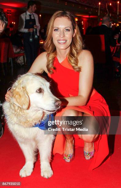 German presenter Jule Goelsdorf with an assistance dog during the 8th VITA Charity Gala In Wiesbaden on October 28, 2017 in Wiesbaden, Germany.