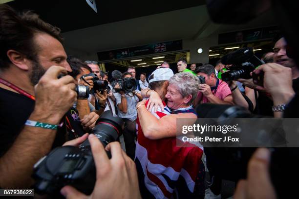 Lewis Hamilton of Mercedes and Great Britain celebrates becoming the 2017 Formula One Drivers World Champion with his Mother Carmen during the...